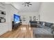 Spacious living room with hardwood floors, vaulted ceilings, built-in shelving and a large comfy sofa at 1325 Moss Path, Mount Pleasant, SC 29464