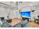 Living room with a large sectional couch, hardwood floors, and high ceilings with a ceiling fan at 1325 Moss Path, Mount Pleasant, SC 29464