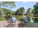 Beautiful pond view featuring mature trees and landscaping at 1325 Moss Path, Mount Pleasant, SC 29464