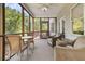 Screened porch with ceiling fan, outdoor furniture, and view at 1325 Moss Path, Mount Pleasant, SC 29464