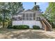 Home's backyard features a screened in porch and deck at 1325 Moss Path, Mount Pleasant, SC 29464
