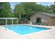 Community pool with lifeguard chair, lounge chairs, and clubhouse in background at 1325 Moss Path, Mount Pleasant, SC 29464