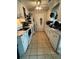 Functional kitchen featuring white appliances, ample cabinet space, and tile flooring for easy cleanup at 1340 Ashley Hall Rd, Charleston, SC 29407