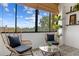 Cozy balcony with comfortable seating and a view of the surroundings, allowing for relaxation at 14 Lockwood Dr # 1C, Charleston, SC 29401