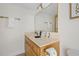 Bright bathroom with a single sink vanity, a large mirror, and modern fixtures for everyday use at 14 Lockwood Dr # 1C, Charleston, SC 29401