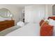 Comfortable bedroom with a bed, closet, dresser, mirror and plenty of light, for a relaxing atmosphere at 14 Lockwood Dr # 1C, Charleston, SC 29401