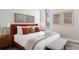 Inviting bedroom with a king-size bed, plush pillows, modern décor, and natural light at 14 Lockwood Dr # 1C, Charleston, SC 29401