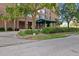 Exterior shot of the building entrance with an awning and landscaping at 14 Lockwood Dr # 1C, Charleston, SC 29401