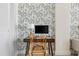 Well-designed home office with a desk, chair, and stylish wallpaper, fostering productivity and creativity at 14 Lockwood Dr # 1C, Charleston, SC 29401