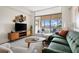 Living room with stylish decor and access to the balcony at 14 Lockwood Dr # 1C, Charleston, SC 29401