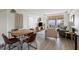 Cozy living room with dining table, comfortable seating, and balcony access at 14 Lockwood Dr # 1C, Charleston, SC 29401