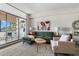 Comfortable living room area with a sofa and view of the balcony at 14 Lockwood Dr # 1C, Charleston, SC 29401