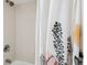 Clean and functional shower with neutral tile and a shower curtain for daily convenience at 14 Lockwood Dr # 1C, Charleston, SC 29401