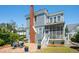 Inviting backyard with a screened porch, brick chimney, grill, and outdoor seating, ideal for gatherings at 15 Rutledge Ave, Charleston, SC 29401