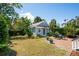 Charming backyard cottage with brick patio and outdoor seating for relaxing and entertaining at 15 Rutledge Ave, Charleston, SC 29401