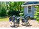Quaint backyard patio with comfortable seating and lush landscaping for relaxation and privacy at 15 Rutledge Ave, Charleston, SC 29401