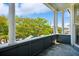 Columned balcony with neighborhood views showcasing outdoor living at 15 Rutledge Ave, Charleston, SC 29401