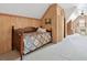 Bedroom with carpet, wood-paneled walls, and exposed brick detail at 15 Rutledge Ave, Charleston, SC 29401