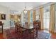 Open-concept dining room featuring a chandelier with views to the living room through a large entryway at 15 Rutledge Ave, Charleston, SC 29401