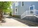 Side of house with a long driveway leading to parking and a charming house exterior at 15 Rutledge Ave, Charleston, SC 29401