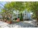 Inviting two-story home with a covered front porch and beautifully landscaped yard at 15 Rutledge Ave, Charleston, SC 29401