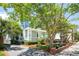 Charming two-story home with a covered porch, mature landscaping, and lovely trees at 15 Rutledge Ave, Charleston, SC 29401