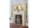 Dining room fireplace with decorative brick interior, mantle with mirror and decorative urns with muraled backdrop at 15 Rutledge Ave, Charleston, SC 29401
