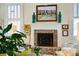 Close up of a brick fireplace featuring decorative artwork, vases, and mantel at 15 Rutledge Ave, Charleston, SC 29401
