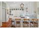 Bright kitchen featuring marble countertops, custom cabinets, and stainless steel appliances at 15 Rutledge Ave, Charleston, SC 29401