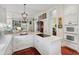 Spacious gourmet kitchen featuring marble countertops, custom cabinets, and stainless steel appliances at 15 Rutledge Ave, Charleston, SC 29401