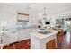 Gourmet kitchen with hardwood floors, marble countertops, and stainless steel appliances at 15 Rutledge Ave, Charleston, SC 29401