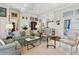 Spacious living room showcasing hardwood floors, bright paint, and views into the kitchen at 15 Rutledge Ave, Charleston, SC 29401