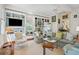 Bright living room featuring custom built-ins, large windows and neutral decor at 15 Rutledge Ave, Charleston, SC 29401