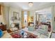 Inviting living room with fireplace and large windows and view of dining room from the living area at 15 Rutledge Ave, Charleston, SC 29401