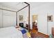 Spacious main bedroom with a fireplace, hardwood floors, and a view to an adjoining room at 15 Rutledge Ave, Charleston, SC 29401
