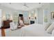 Main bedroom with comfortable bed, fireplace, and light-filled windows at 15 Rutledge Ave, Charleston, SC 29401