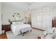Spacious main bedroom with built-in storage, light color palette and relaxing decor at 15 Rutledge Ave, Charleston, SC 29401