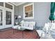 Outdoor patio with comfortable seating, tile flooring, and an umbrella for shade at 15 Rutledge Ave, Charleston, SC 29401