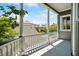 Charming porch with white columns, dark grey railings and neighborhood views at 15 Rutledge Ave, Charleston, SC 29401