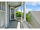 Exterior porch showing white pillars, painted grey railings and open view at 15 Rutledge Ave, Charleston, SC 29401