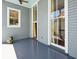 View of covered porch with painted wood floors and accents at 15 Rutledge Ave, Charleston, SC 29401
