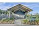 The community area has tables and bench seating, with plenty of overhead coverage and landscaping at 150 Midtown Ave, Summerville, SC 29486