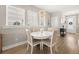 Bright dining area with a modern chandelier and large windows allowing plenty of natural light at 150 Midtown Ave, Summerville, SC 29486
