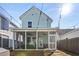 Backyard view of a screened-in porch with patio furniture and an inflatable hot tub at 150 Midtown Ave, Summerville, SC 29486