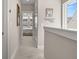 Upstairs hallway leading to bedrooms offering a peek of the bedroom with natural light at 150 Midtown Ave, Summerville, SC 29486