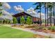 Modern info studio with sleek architecture, lush landscaping, and a welcoming entrance at 150 Midtown Ave, Summerville, SC 29486