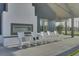 The porch has an outdoor fireplace and rocking chairs at 150 Midtown Ave, Summerville, SC 29486