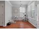 Bright dining area with wood floors, a pendant light, and a pet play center at 1589 Bluewater Way, Charleston, SC 29414