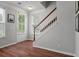 Bright entryway features hardwood floors and stairs leading to the upper level at 1589 Bluewater Way, Charleston, SC 29414