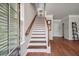 Bright entryway with hardwood floors and stairs leading to the upper level at 1589 Bluewater Way, Charleston, SC 29414
